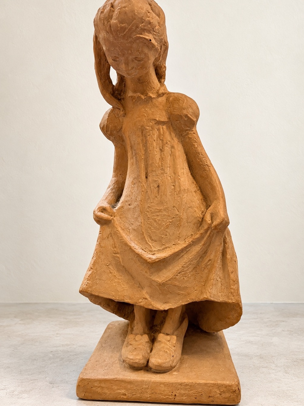 'Dress Up' little girl looking down statue by artist Klara Sever 1972 Heavy